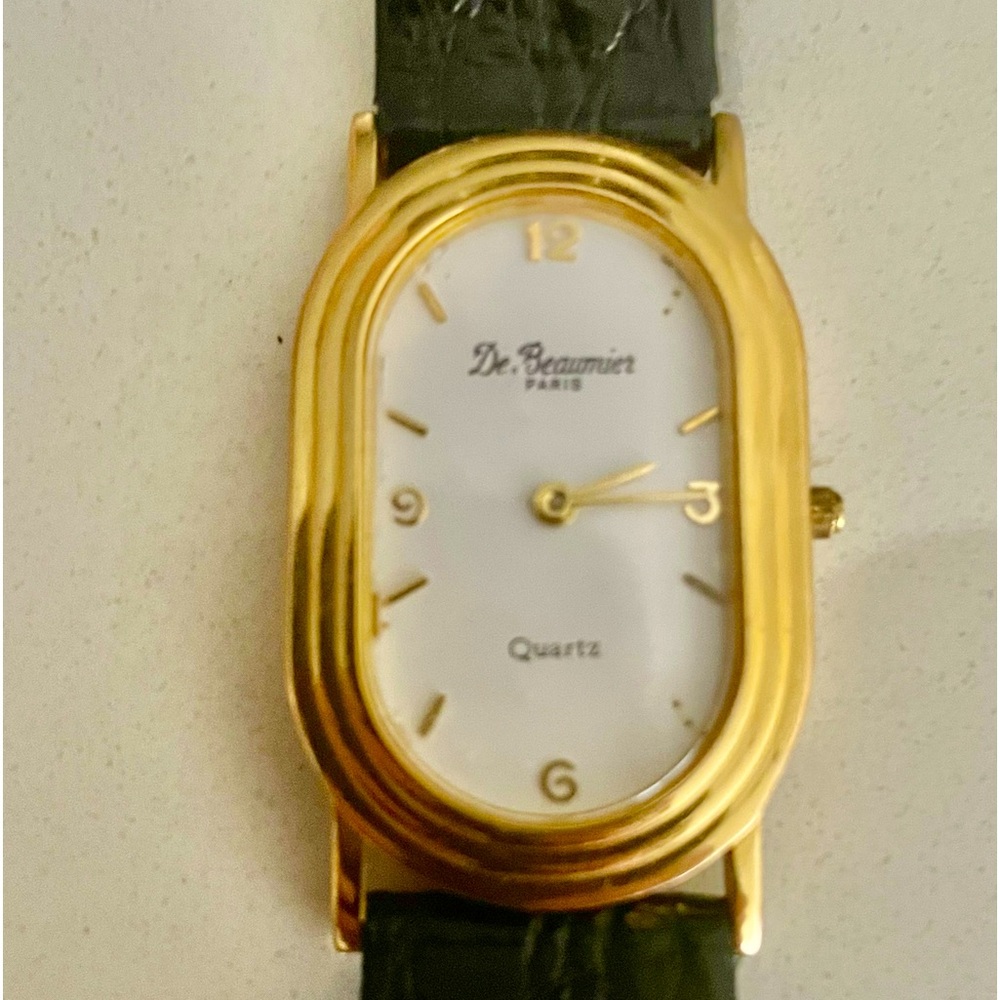 Stunning designer style watch with black band.